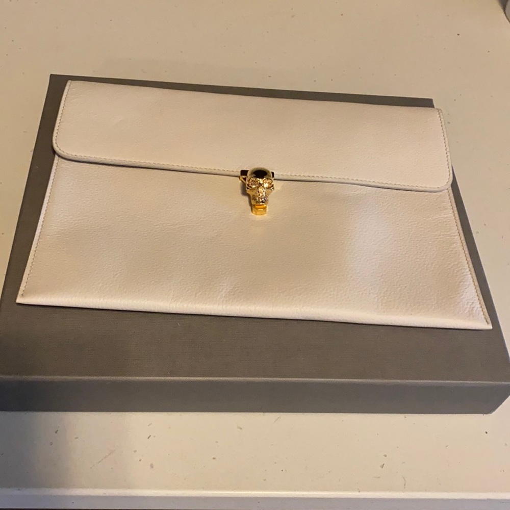Alexander McQueen beige clutch with gold skull closure (with box and dust cloth)